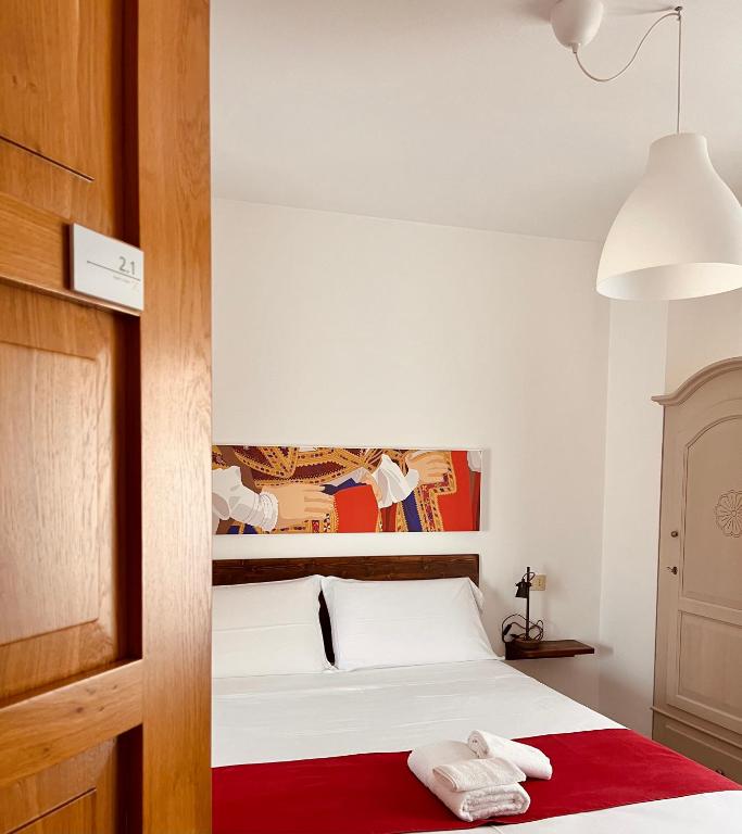 Postel nebo postele na pokoji v ubytování Carrales Guest House