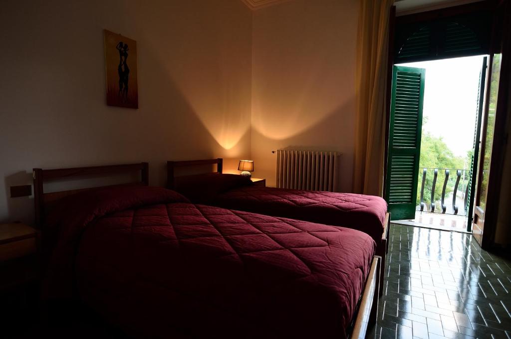 Postel nebo postele na pokoji v ubytování Hotel La Silvana