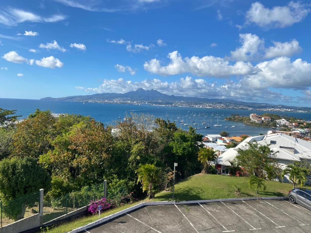 a view of the ocean from a house at Beautiful Day Studio in Les Trois-Îlets