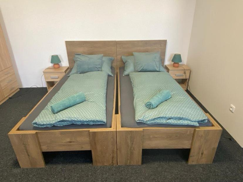 Кровать или кровати в номере Penzion Miluška