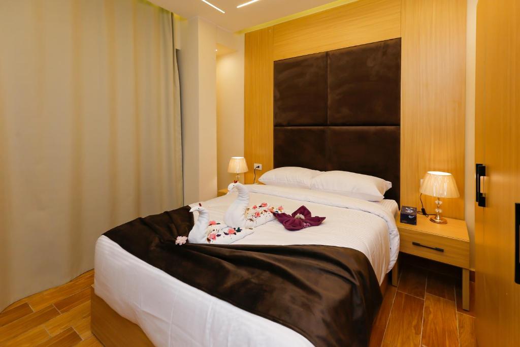 Postel nebo postele na pokoji v ubytování Rizk Pyramids View Hotel