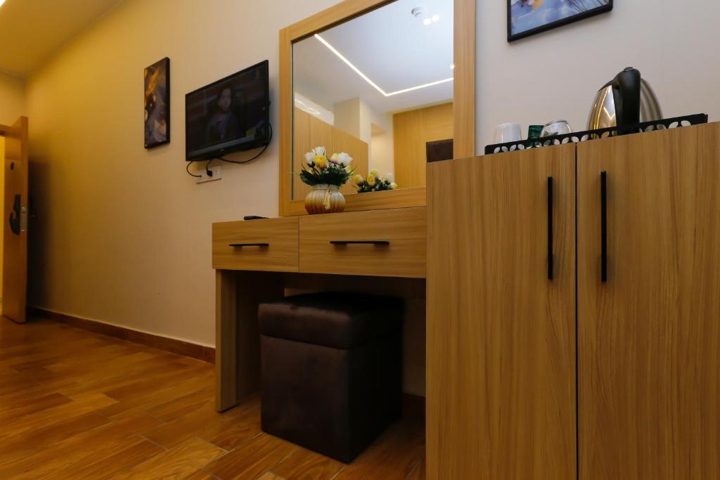 TV a/nebo společenská místnost v ubytování Rizk Pyramids View Hotel