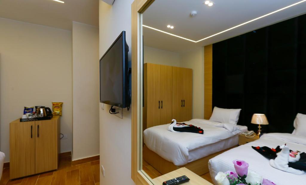 TV a/nebo společenská místnost v ubytování Rizk Pyramids View Hotel