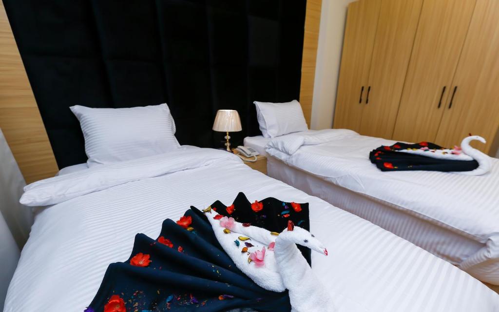 Postel nebo postele na pokoji v ubytování Rizk Pyramids View Hotel