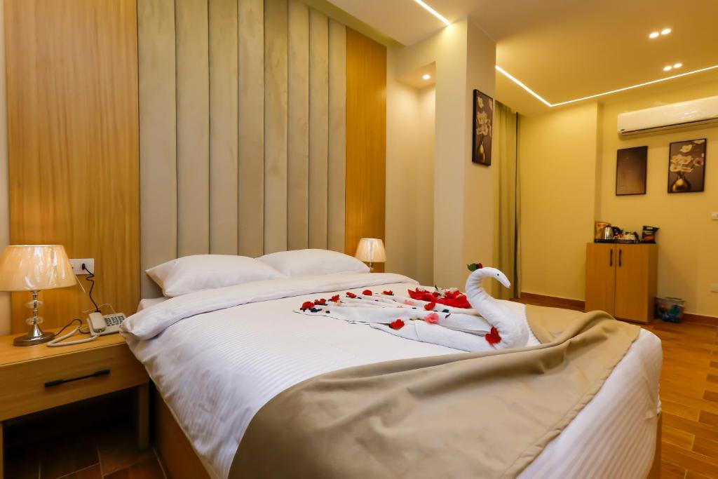 Postel nebo postele na pokoji v ubytování Rizk Pyramids View Hotel