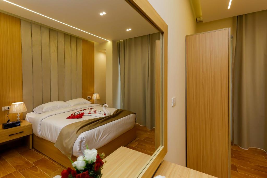 Postel nebo postele na pokoji v ubytování Rizk Pyramids View Hotel