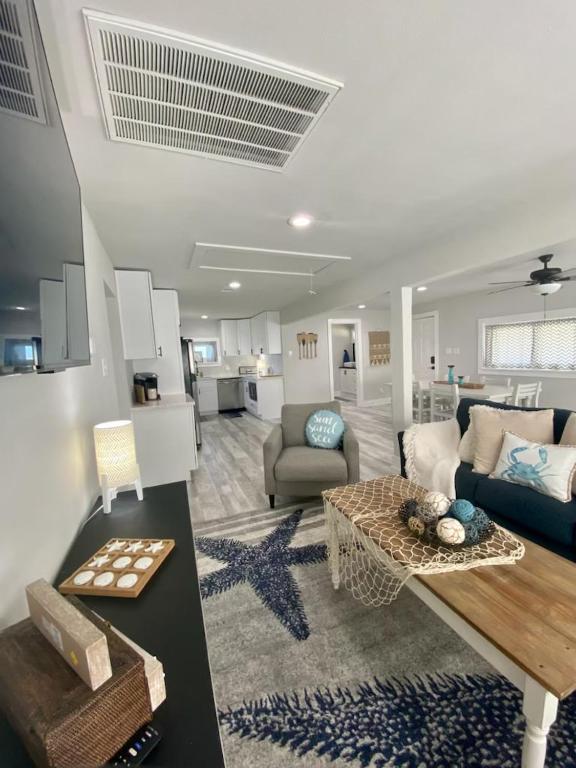 a living room with a couch and a table at Sandy Haven in Bolivar Peninsula