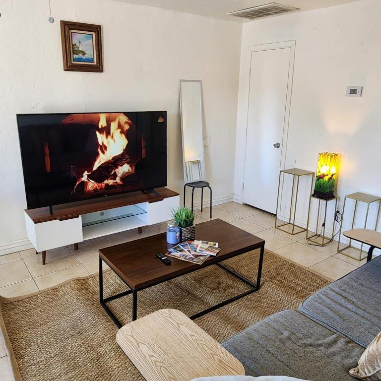 a living room with a large flat screen tv at *Msg for 5%off*2Bed1Bath KingQueenBeds MidtownPHX in Phoenix