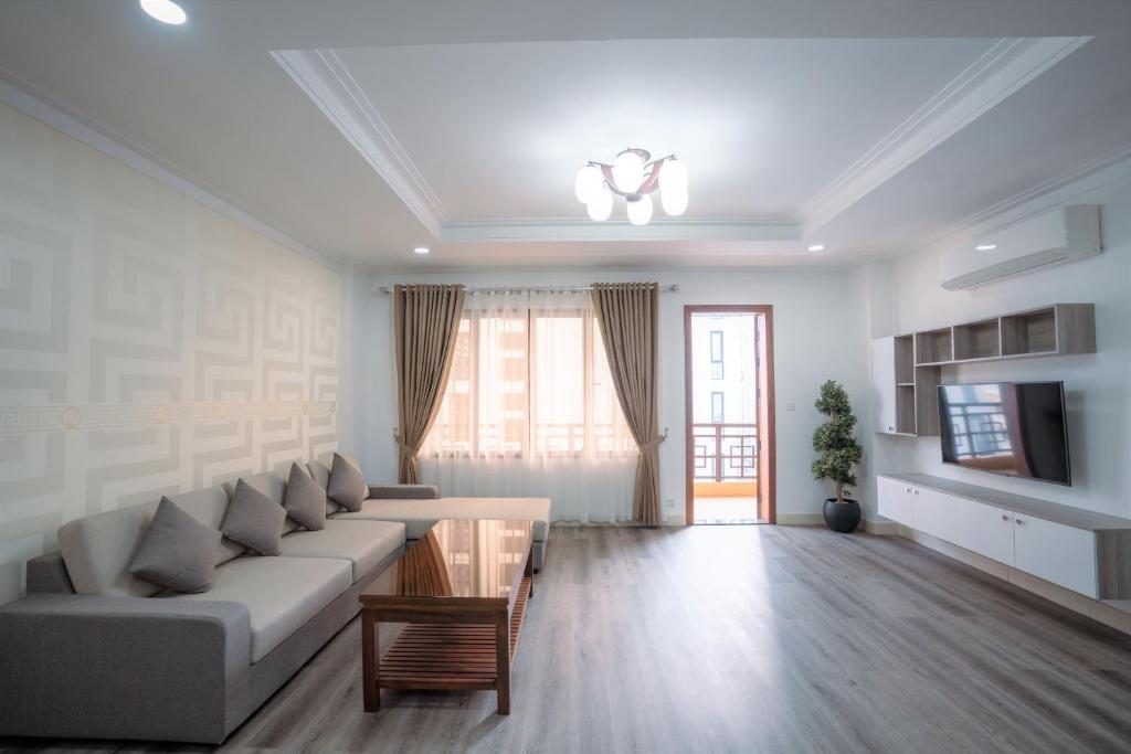 TV a/nebo společenská místnost v ubytování HAMPTONS Apartments