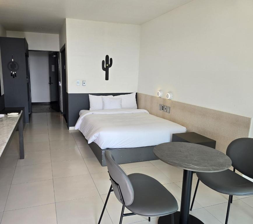 Postel nebo postele na pokoji v ubytování Lareem Boutique Hotel