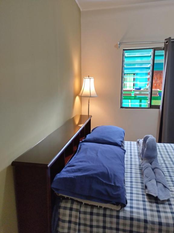 Postel nebo postele na pokoji v ubytování Hotel Trianon