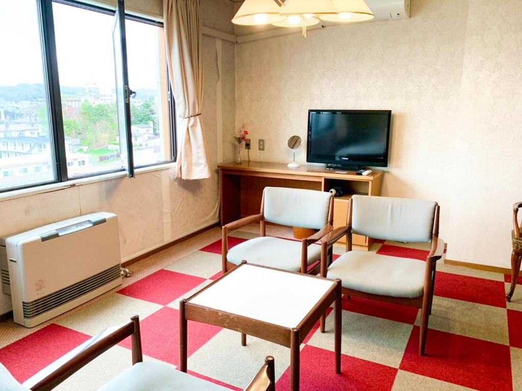 a waiting room with two chairs and a tv at Hotel Royal Kitami - Vacation STAY 06513v in Kitami