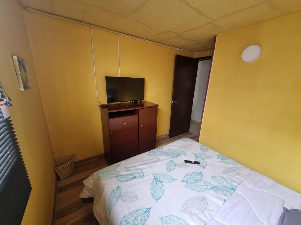 Postel nebo postele na pokoji v ubytování Casa Dohko