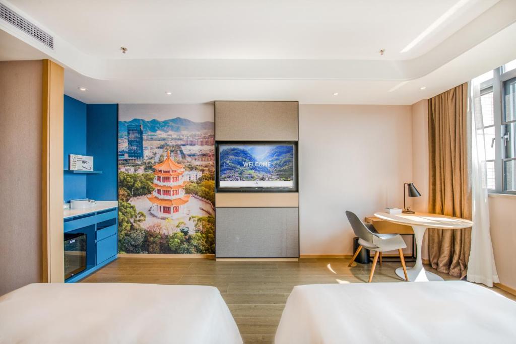 Postel nebo postele na pokoji v ubytování Atour Hotel Zhongshan Tanzhou