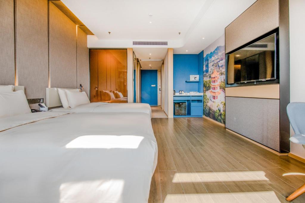 Postel nebo postele na pokoji v ubytování Atour Hotel Zhongshan Tanzhou