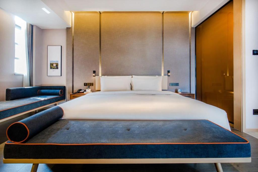 Postel nebo postele na pokoji v ubytování Atour Hotel Zhongshan Tanzhou