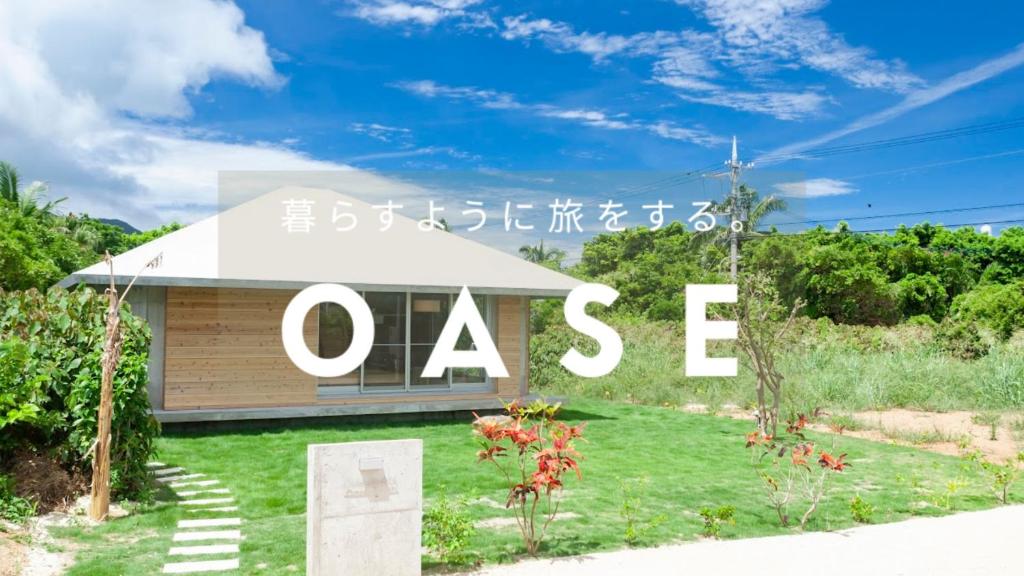 una señal para una casa con la palabra oasis en Oase Akaishi - Vacation STAY 69684v, en Ibaruma