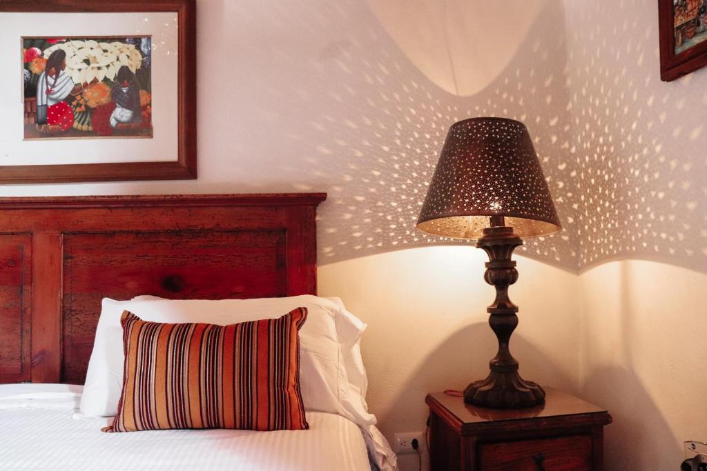 Postel nebo postele na pokoji v ubytování Mansion de los Sueños