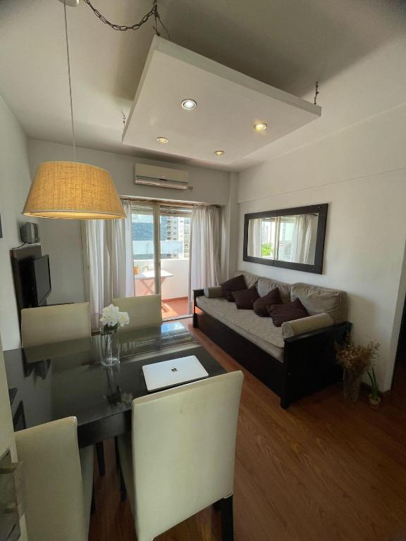 a living room with a couch and a table at La Plata Housing I in La Plata