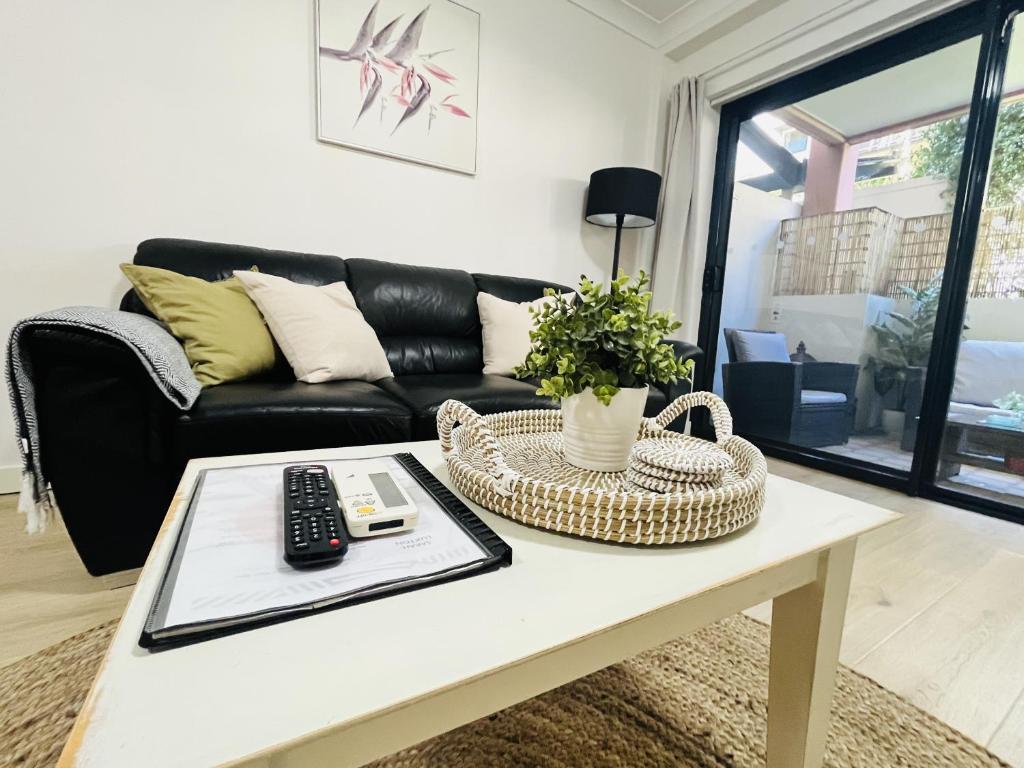 a living room with a couch and a coffee table at 2 Paradise Pool Parking Huge 1br Cbd in Perth