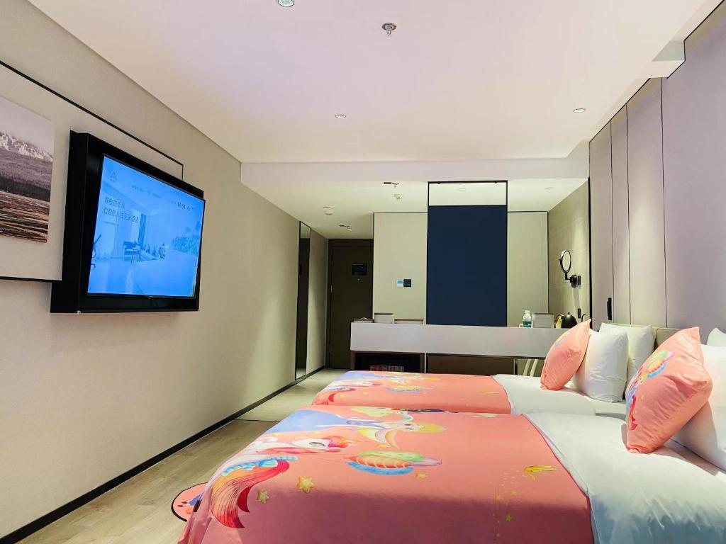 Postel nebo postele na pokoji v ubytování Atour Hotel Zhaoqing Qixingyan