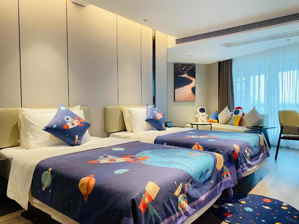 Postel nebo postele na pokoji v ubytování Atour Hotel Zhaoqing Qixingyan