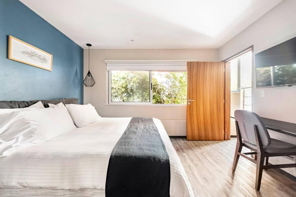 Ένα ή περισσότερα κρεβάτια σε δωμάτιο στο Excelente loft con terraza Polanco (INGA)