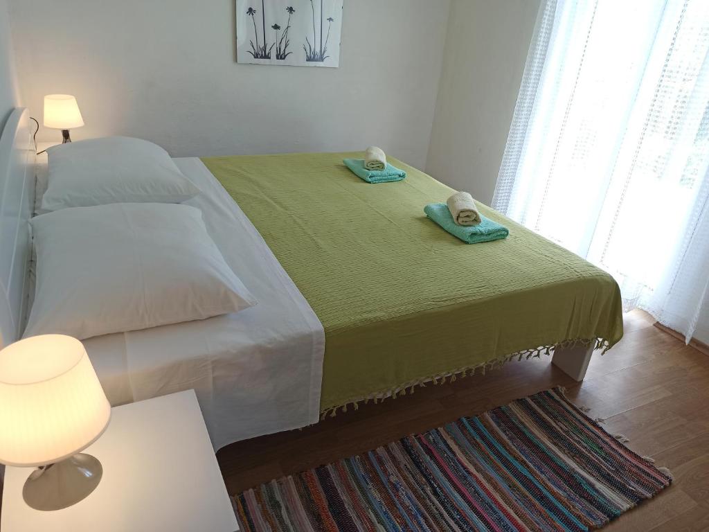 Łóżko lub łóżka w pokoju w obiekcie Apartments Sonija