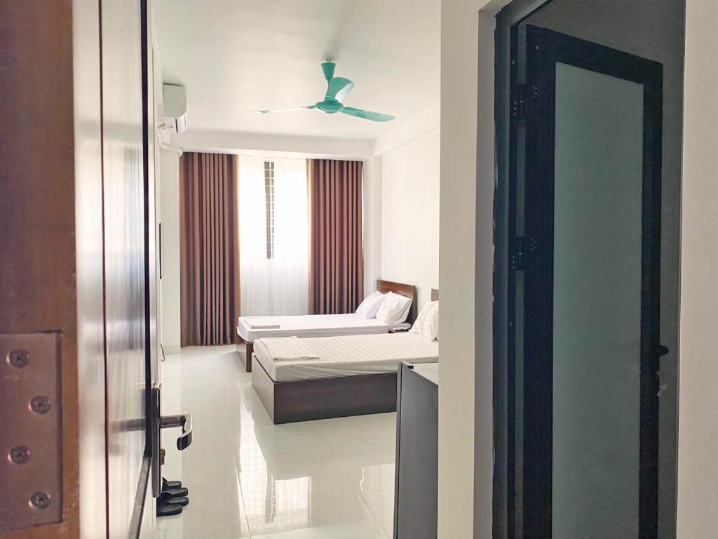 Postel nebo postele na pokoji v ubytování GRAD Minh Trang Motel