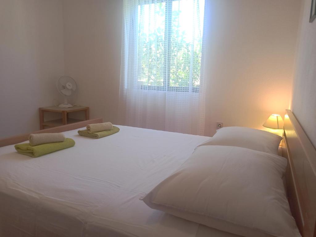 Łóżko lub łóżka w pokoju w obiekcie Apartments Sonija