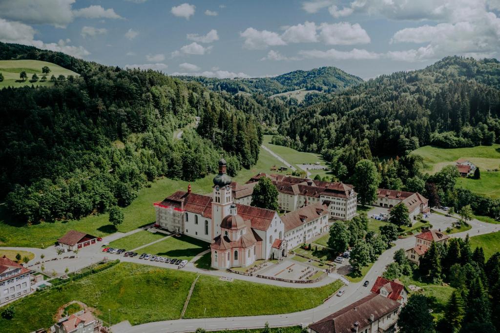 an aerial view of a mansion in the mountains at Hotel Kloster Fischingen in Fischingen