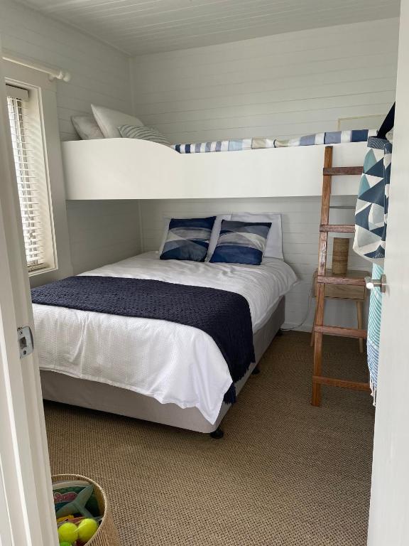 Postel nebo postele na pokoji v ubytování BELLE VUE BEACH HOUSE