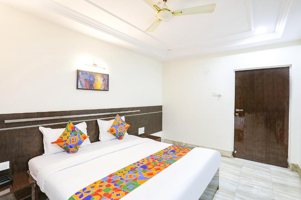 a bedroom with two beds in a room at FabHotel Shirdi Park Inn in Shirdi
