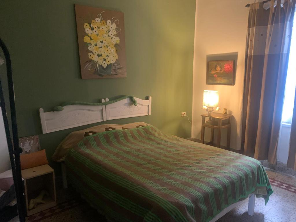 A bed or beds in a room at Villa Julia Veneria