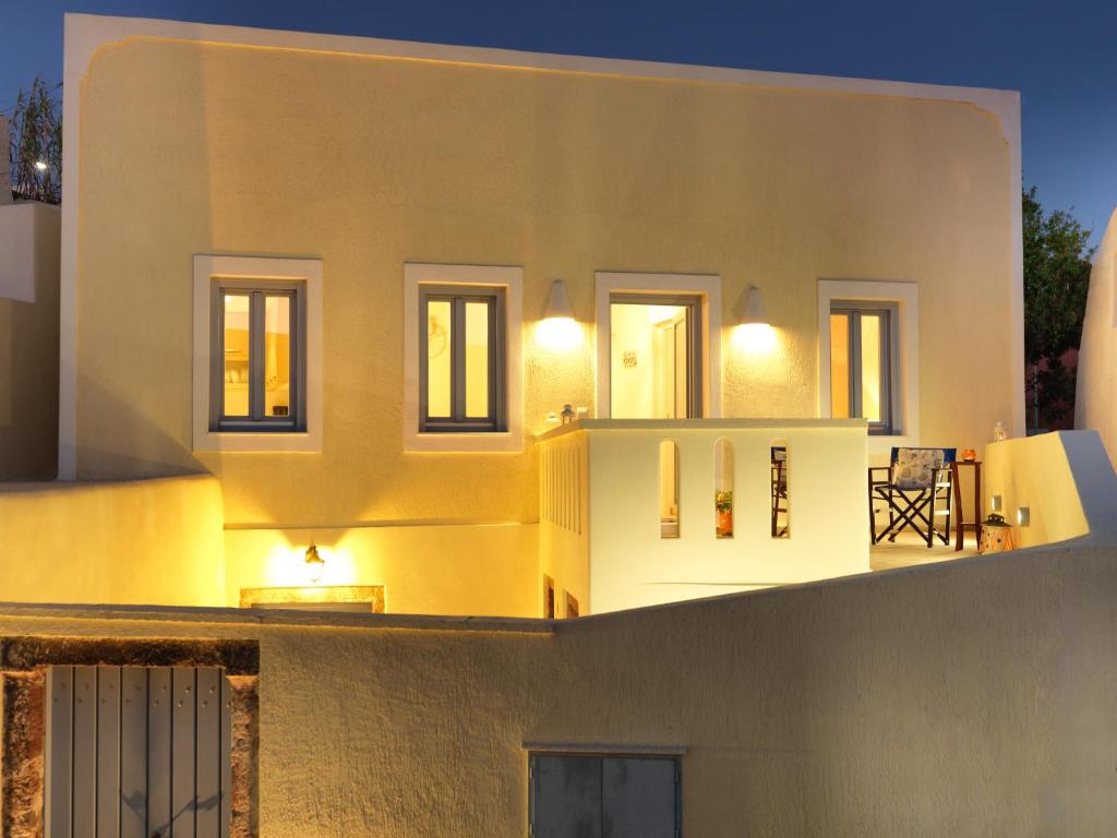 a view of the back of a house at night at Blue and White Aura Santorini traditional house in Megalochori