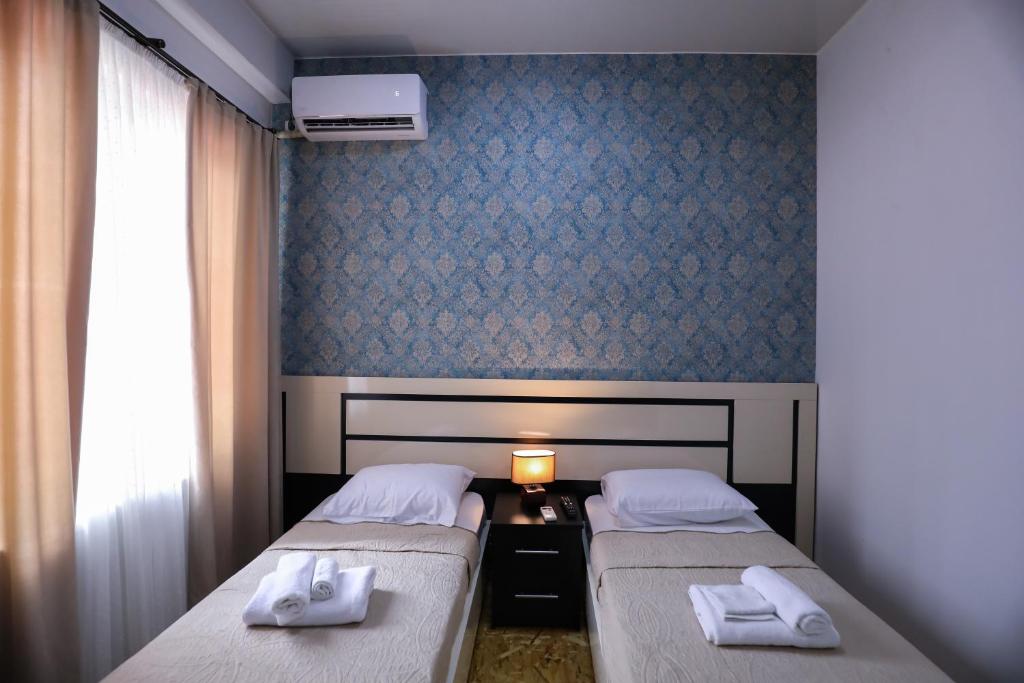 Postel nebo postele na pokoji v ubytování Hotel Sagu