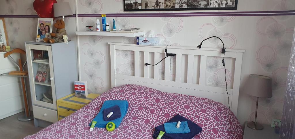 a childs bedroom with a bed with a toy train on it at Chambre d&#39;hôte in Saint-Ouen