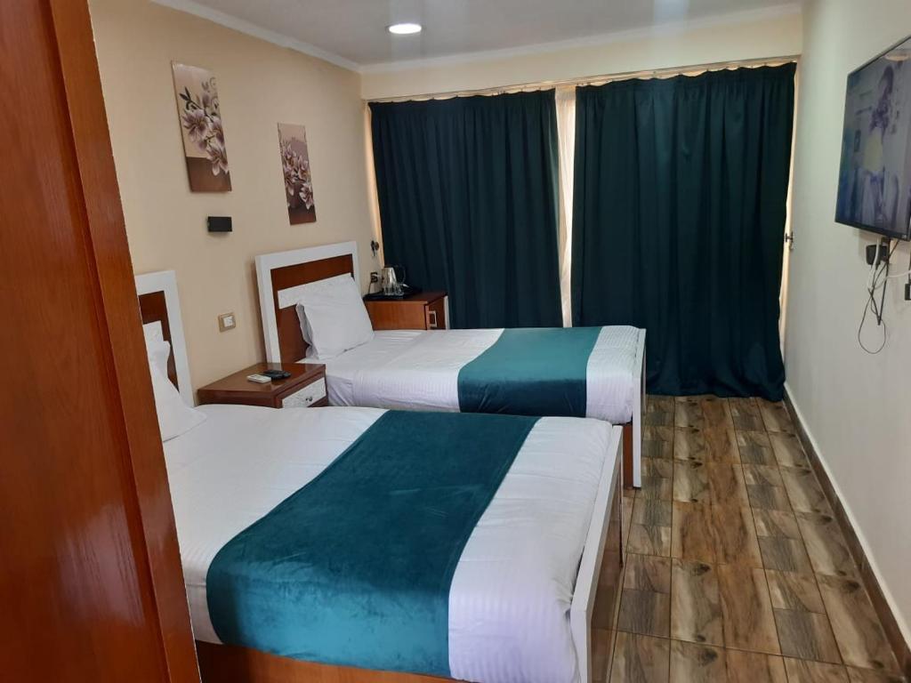 Postel nebo postele na pokoji v ubytování Al-Galaa Club