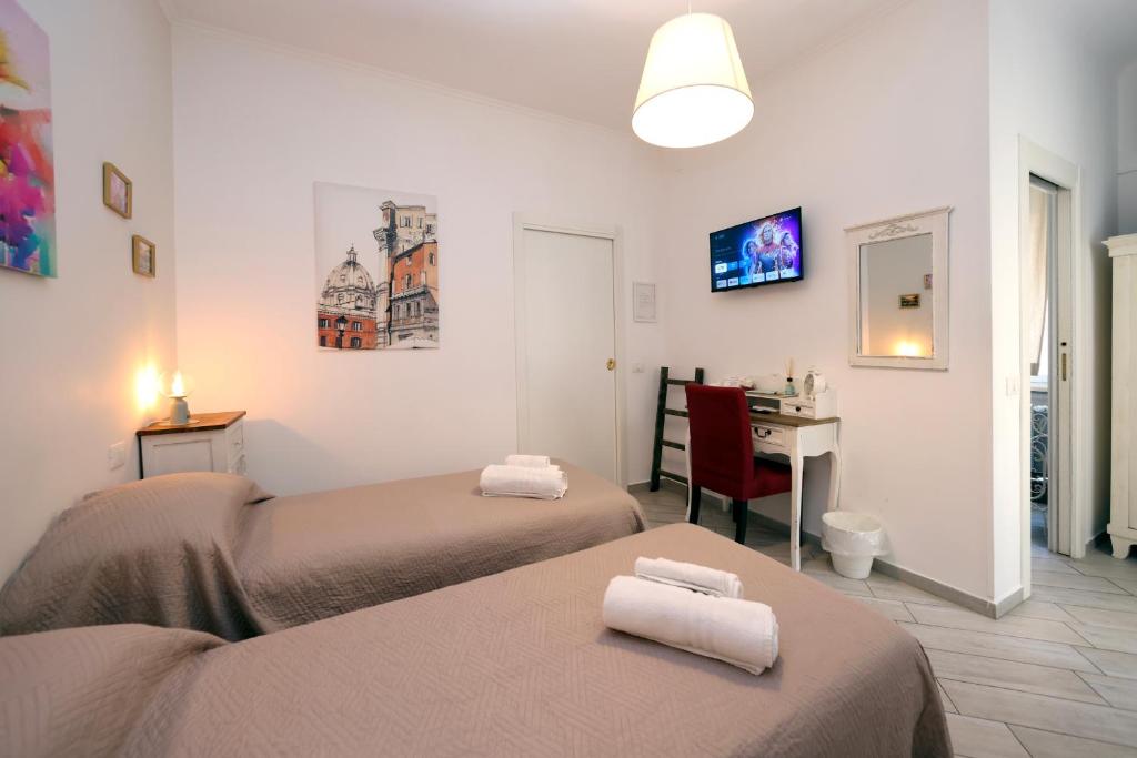 A bed or beds in a room at Sivory Rome