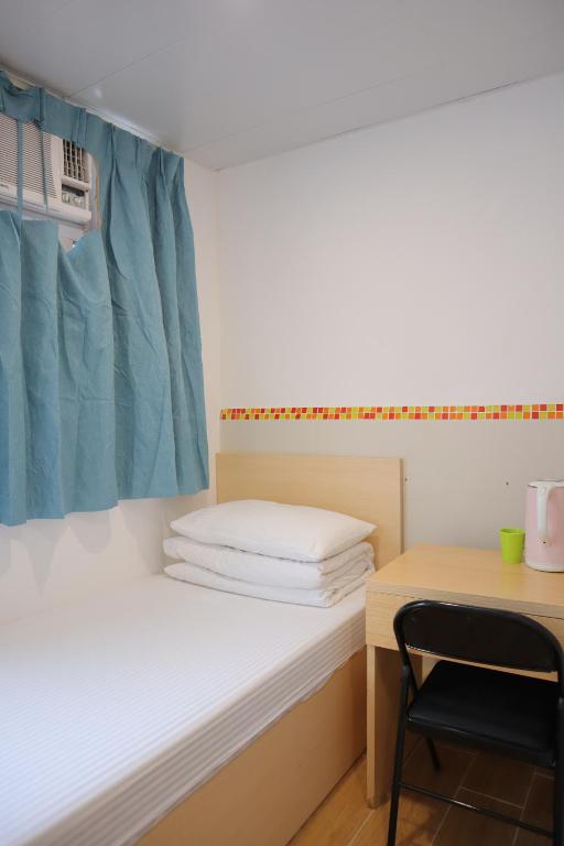 Postel nebo postele na pokoji v ubytování Timehouse Hong Kong Hostel Group