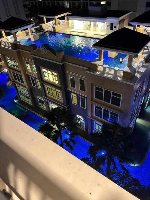 an aerial view of a building with blue lights at Arcadia Beach Resort Condominium in Pattaya South