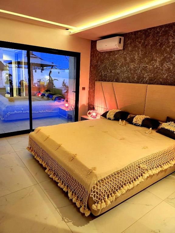 Postel nebo postele na pokoji v ubytování Villa Haut Standing Dar Tralala, Djerba Tunisie