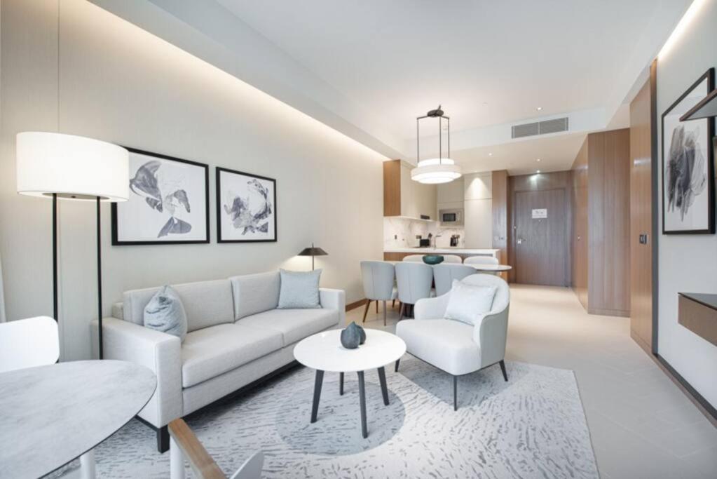 a living room with a couch and a table at Luxurious stay in Downtown Dubai in Dubai