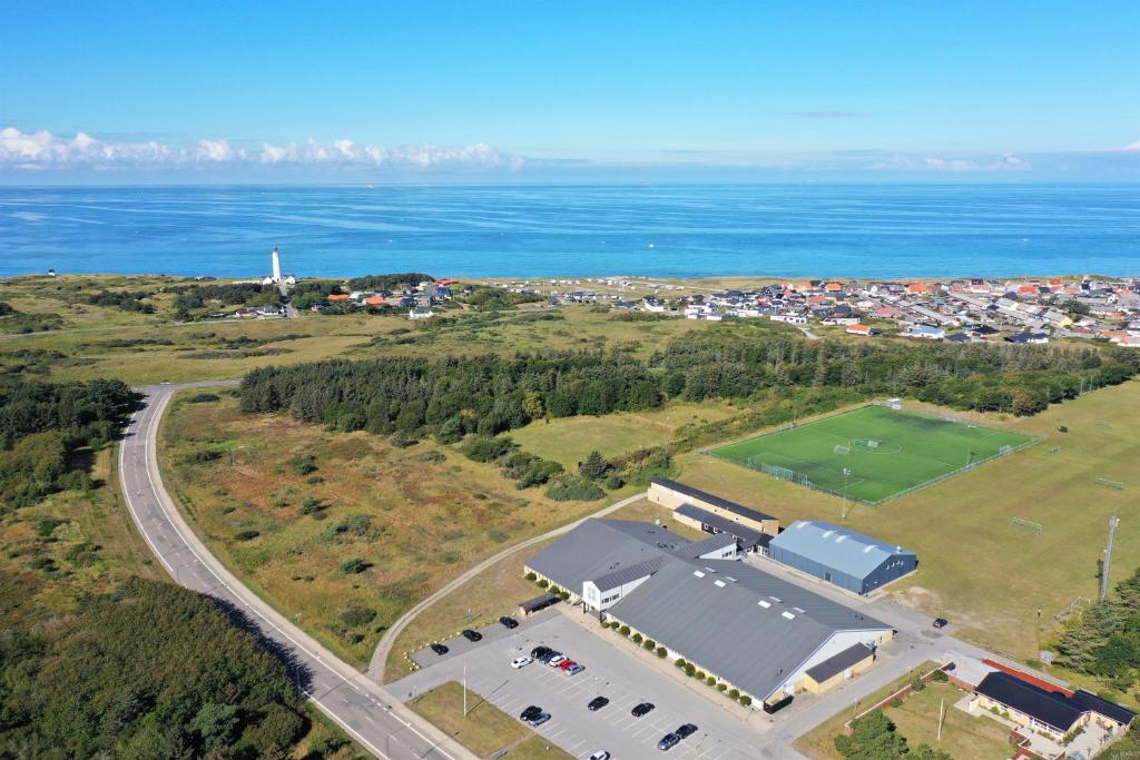 an aerial view of a parking lot next to the ocean at Hirtshals Idrætscenter - Vandrehjem - Hostel in Hirtshals
