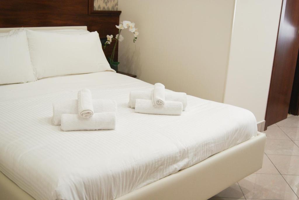 Postel nebo postele na pokoji v ubytování Monti 66 Hotel