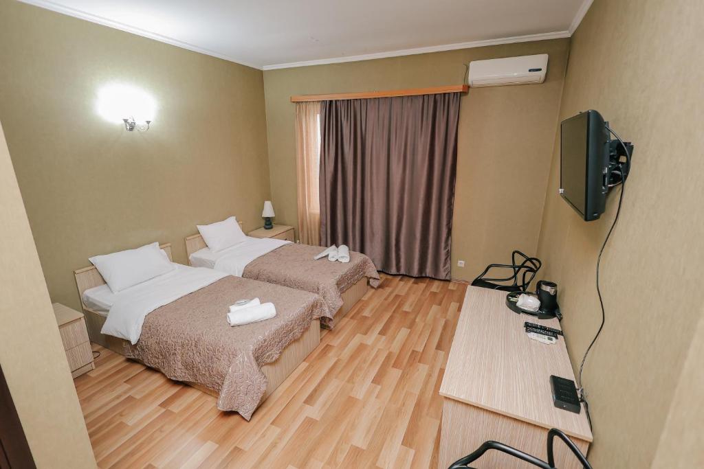 TV a/nebo společenská místnost v ubytování Hotel Darchi