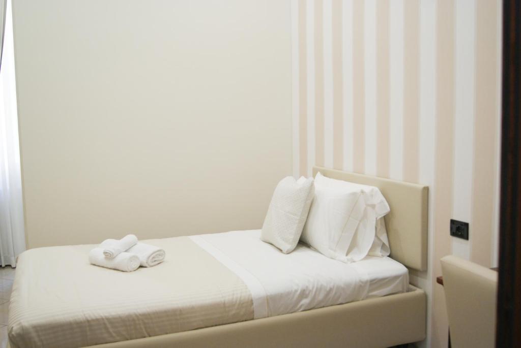 Postel nebo postele na pokoji v ubytování Monti 66 Hotel