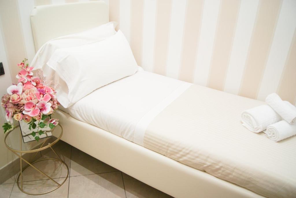 Postel nebo postele na pokoji v ubytování Monti 66 Hotel