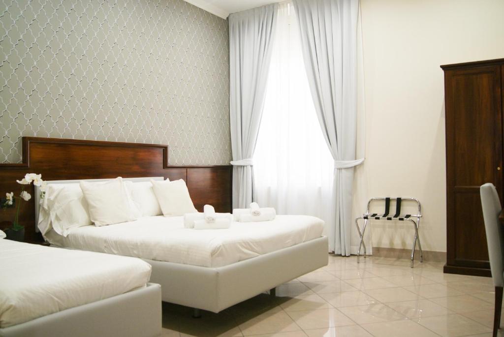Postel nebo postele na pokoji v ubytování Monti 66 Hotel