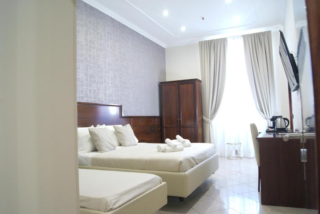 Postel nebo postele na pokoji v ubytování Monti 66 Hotel
